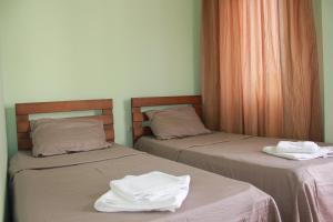 Postel nebo postele na pokoji v ubytování Hotel Premium