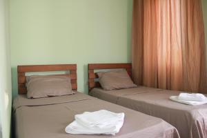 Postel nebo postele na pokoji v ubytování Hotel Premium