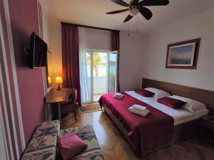 Postel nebo postele na pokoji v ubytování Guest House Palme