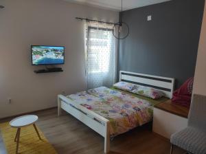 Posteľ alebo postele v izbe v ubytovaní Apartments Magaza