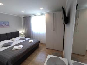 Postel nebo postele na pokoji v ubytování Guest House Palme