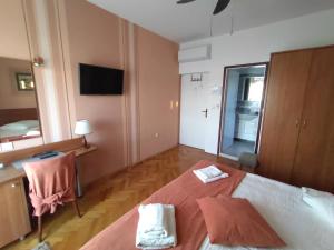 Postel nebo postele na pokoji v ubytování Guest House Palme