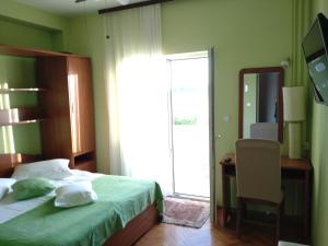 Postel nebo postele na pokoji v ubytování Guest House Palme
