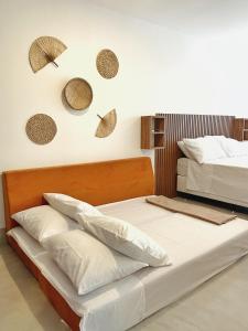 Uma cama ou camas num quarto em Casa AXÉ - Morro de São Paulo - Bahia