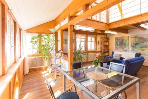 a living room with a couch and a table at Maisonette Baugut in Remlingen