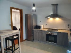A kitchen or kitchenette at Coco Pardal, Pontevedra
