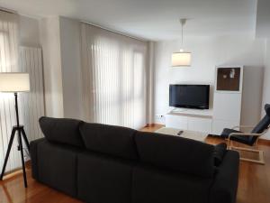 A television and/or entertainment centre at Coco Pardal, Pontevedra