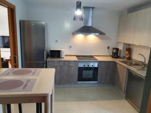 A kitchen or kitchenette at Coco Pardal, Pontevedra