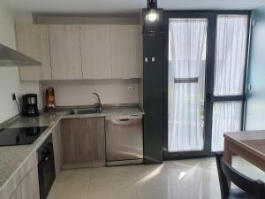 A kitchen or kitchenette at Coco Pardal, Pontevedra