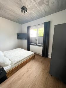 Postel nebo postele na pokoji v ubytování Dyke Appartements