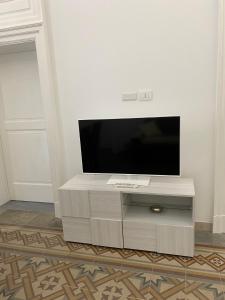 A television and/or entertainment centre at M.Mansion