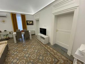 A television and/or entertainment centre at M.Mansion