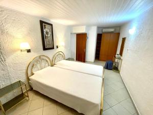 Postel nebo postele na pokoji v ubytování Kommeno Bay Apartments