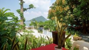 a view of the ocean from a resort with plants at Baywalk Suites Batangas in Laurel