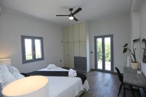Łóżko lub łóżka w pokoju w obiekcie Villa Chroussa
