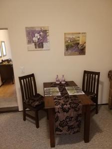 a dining room table with two chairs and a table and a table and chairsonnaissance at Schloss Kobershain in Schildau