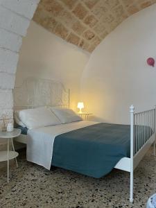 A bed or beds in a room at Maison Anthea