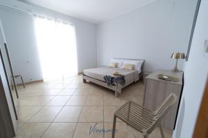 A bed or beds in a room at San Martino Holiday Apartments