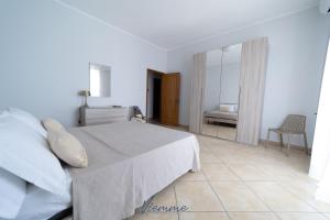 A bed or beds in a room at San Martino Holiday Apartments