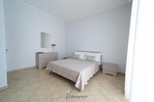 A bed or beds in a room at San Martino Holiday Apartments