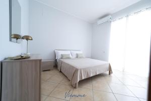 A bed or beds in a room at San Martino Holiday Apartments