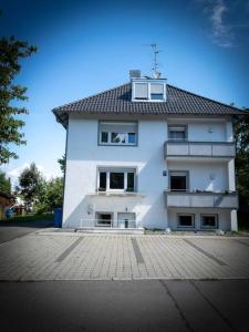 a large white building with a roof at Lovely 2 bedroom apartment Lemon Grass in Central Lindau in Lindau