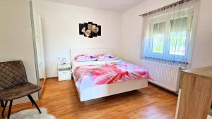 Postel nebo postele na pokoji v ubytování Apartments Pinezić