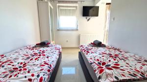 Posteľ alebo postele v izbe v ubytovaní Apartments Pinezić