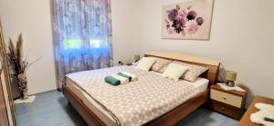 Postel nebo postele na pokoji v ubytování Apartments Pinezić