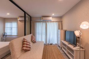 Voodi või voodid majutusasutuse Title Naiyang residence Excellent location with pool view toas