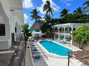 a view of the pool at the resort at Dhow Resort in Jambiani