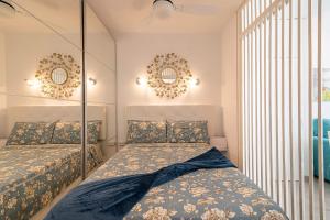 Łóżko lub łóżka w pokoju w obiekcie LA SIESTA APARTMENT