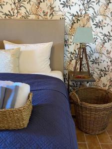 a bedroom with a bed and a table with a lamp at La Pastorella in Maierà