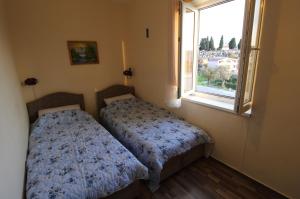 Postel nebo postele na pokoji v ubytování Apart hotel St.Pijerre