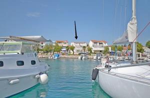 a group of boats docked in a harbor at Apartment and Rooms Dalmatiko in Vodice