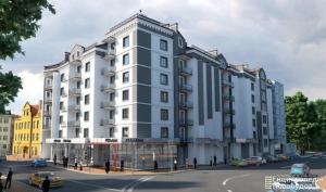 a large white building on a city street at Комфортні апартаменти 82 in Ivano-Frankivsk