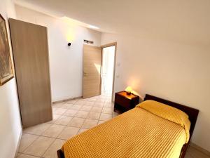 Ένα ή περισσότερα κρεβάτια σε δωμάτιο στο Luminoso appartamento indipendente, al mare !