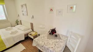 Posteľ alebo postele v izbe v ubytovaní Apartment PIPO