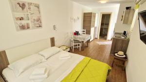 Posteľ alebo postele v izbe v ubytovaní Apartment PIPO