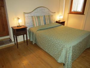 Postel nebo postele na pokoji v ubytování Agriturismo Borgo Del Papa