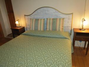 Postel nebo postele na pokoji v ubytování Agriturismo Borgo Del Papa