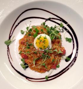 a plate of food with an egg on top at Embrace Calistoga in Calistoga