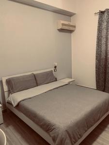 a bedroom with a bed in a room at Casa Vacanza Elena in Capo dʼOrlando