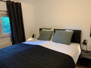 מיטה או מיטות בחדר ב-Bed en Natuurhuisje