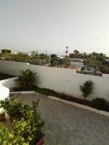 a garden with plants and a white fence at Villa Anna Maria in Polignano a Mare