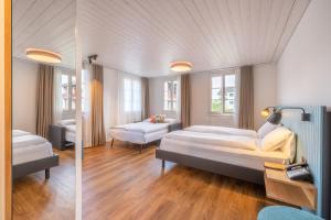 Postel nebo postele na pokoji v ubytování Boutique Hotel Balm