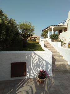 a shadow of a bike on the wall of a house at Villa Anna Maria in Polignano a Mare