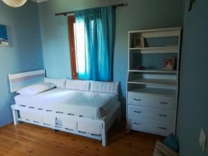 Posteľ alebo postele v izbe v ubytovaní Cycladic House