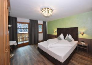 Postel nebo postele na pokoji v ubytování Hotel Rosengarten