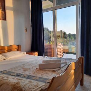 Postel nebo postele na pokoji v ubytování Arabela Apartments